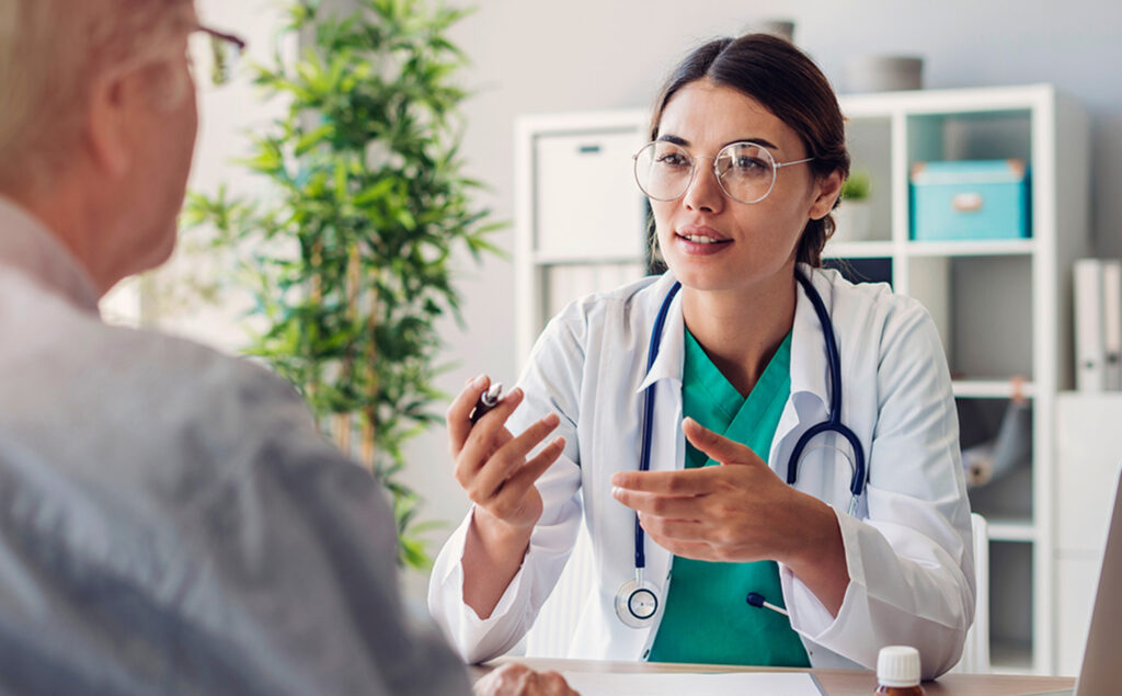 a doctor talking to a patient in an office