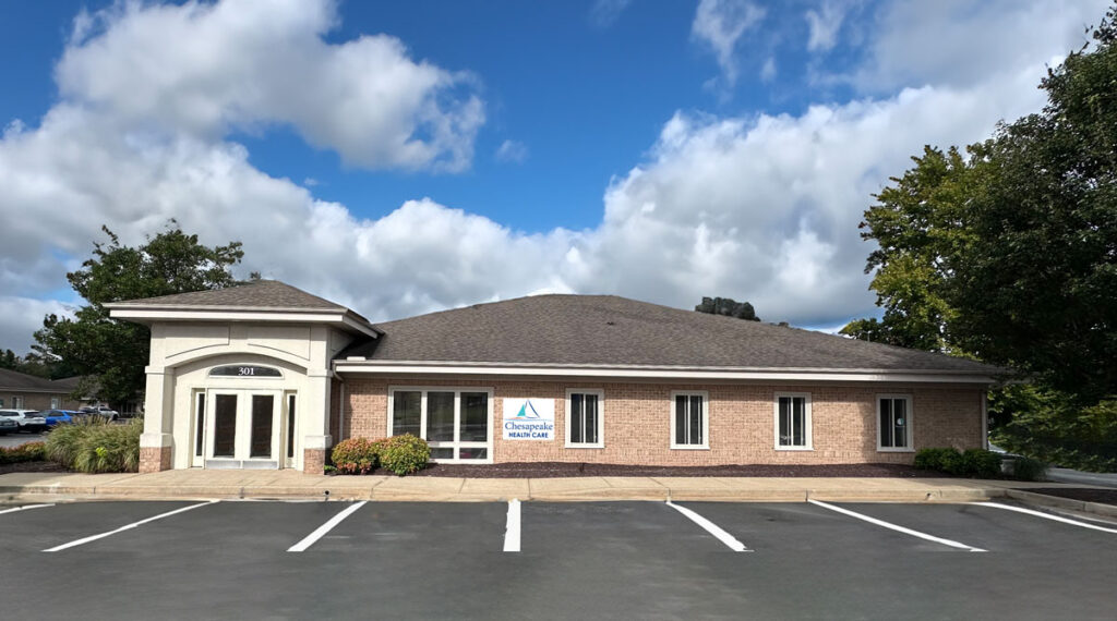 a building with a parking lot in front of it