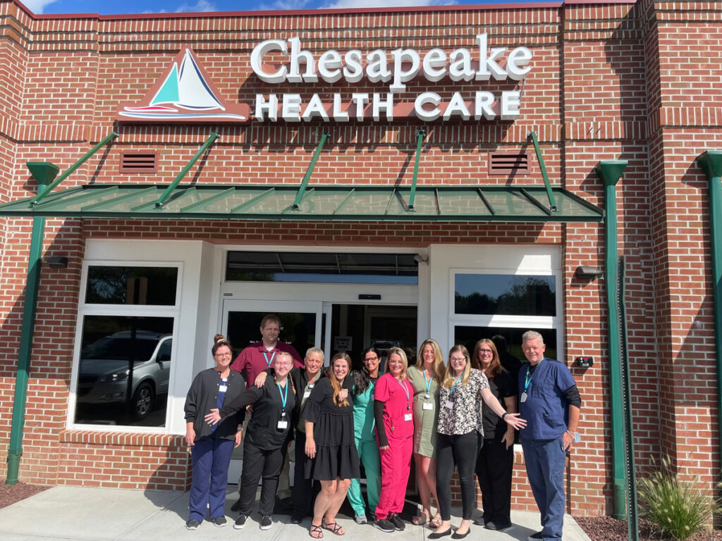 a group of people standing outside of a building