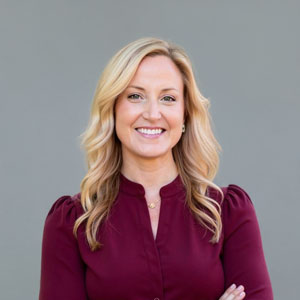 a woman standing with her arms crossed